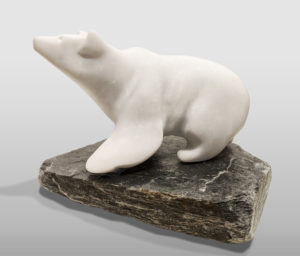 "Polar Bear," by Herb Latreille 13" (L) x 10" (H) incl. base - Glacierite on slate base $1700