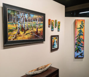 David Langevin wall, including a new 12" x 48" painting (R) from his regular page. Ceramic sculpture by Laurie Rolland.